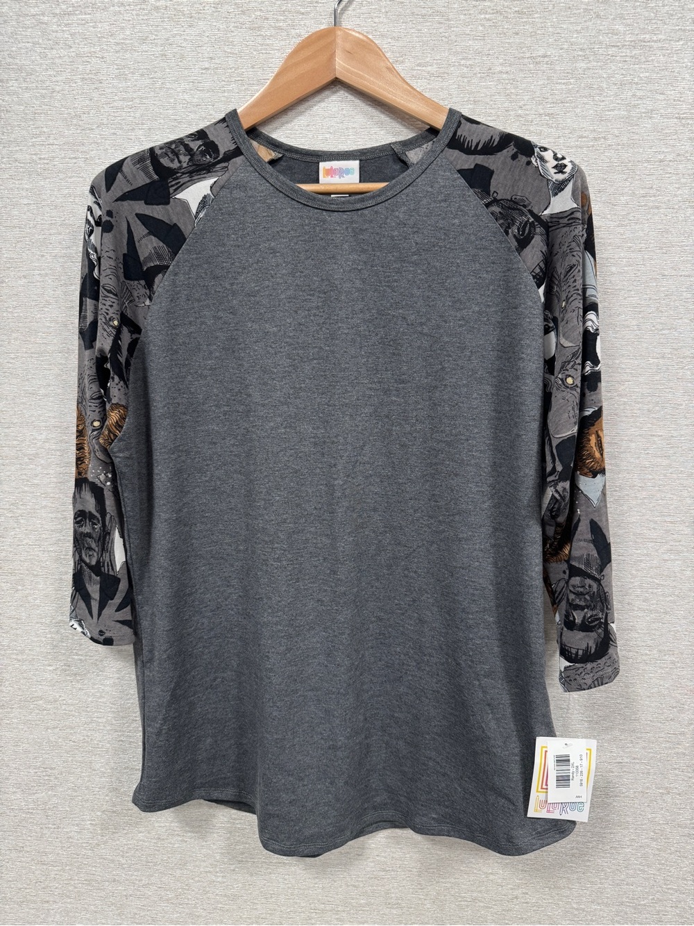 LuLaRoe (Randy) Charcoal Raglan Top with Patterned Black & Tan Sleeves